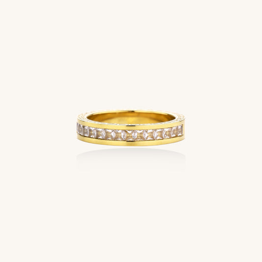 14K gold plated ring with channel-set zirconia stones and Greek key pattern engraved on sides on white background